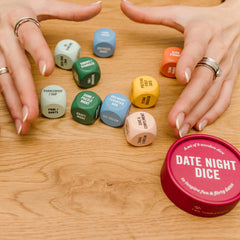 Two Tumbleweeds dice sit on a coffee table ready for a date night