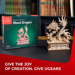 UGEARS Dragon puzzle box showing mechanical button for interactive play
