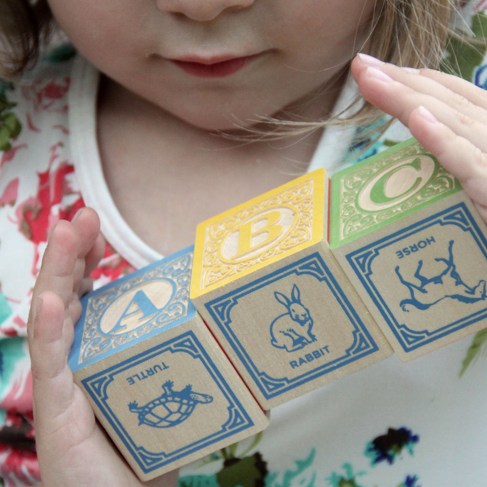 Uncle Goose Classic ABC Blocks feature hand-crafted animals for storytelling and imaginative play.
