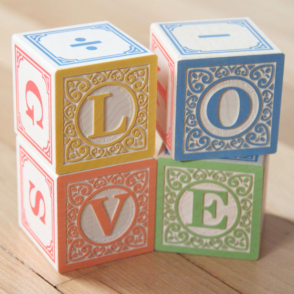 Uncle Goose Classic ABC Blocks highlight embossing on two sides for tactile exploration.
