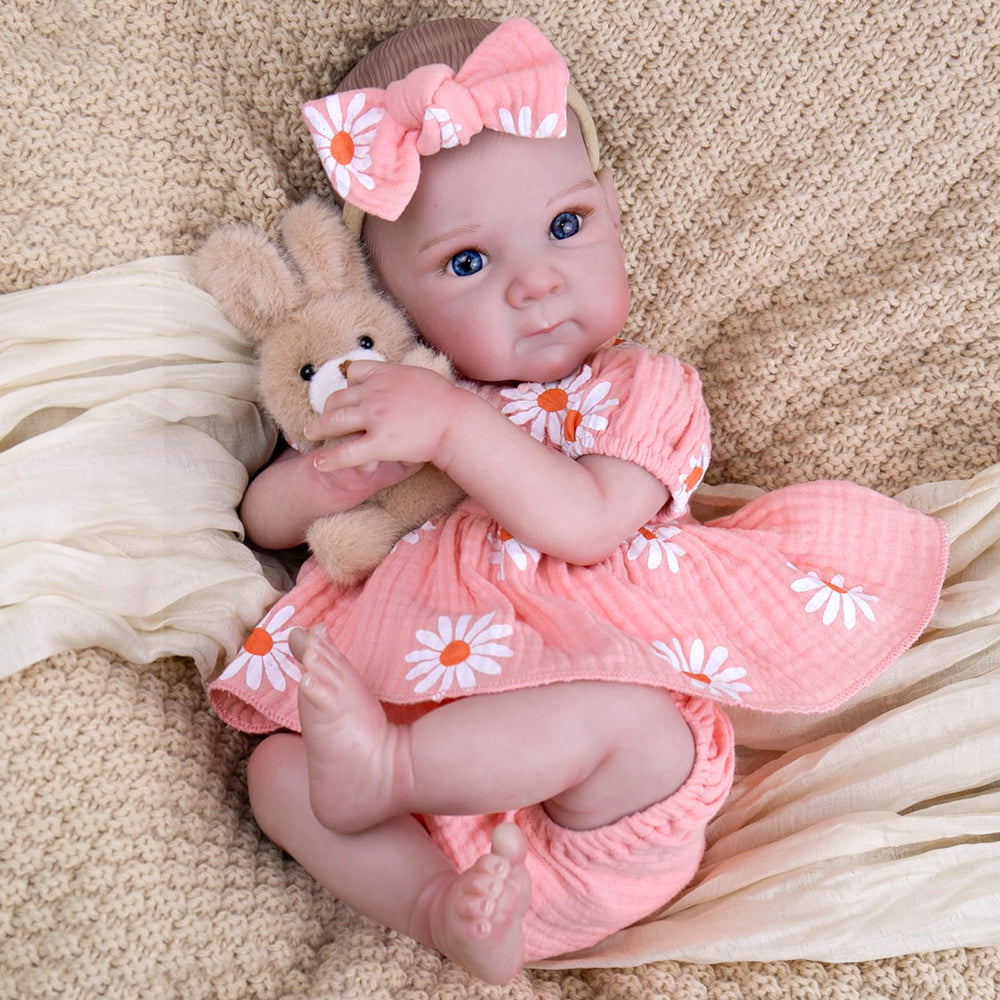 UOFTKIZ reborn doll in a daisy-print skirt for imaginative pretend play.