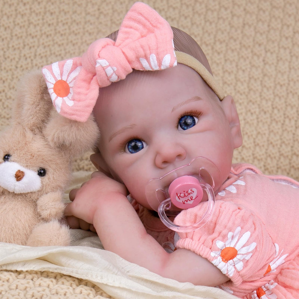 UOFTKIZ 20in doll with pink bow, ideal cuddle buddy for kids.