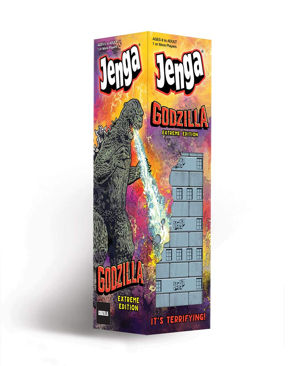 USAOPOLY Godzilla Extreme Edition tower under attack during dramatic gameplay.