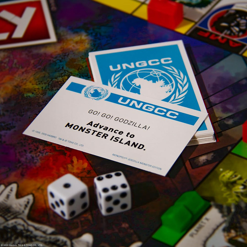 USAOPOLY Godzilla token on the board, a dominant presence during play.