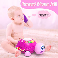 Ussybaby turtle toy phone feature encourages pretend conversations for social play.