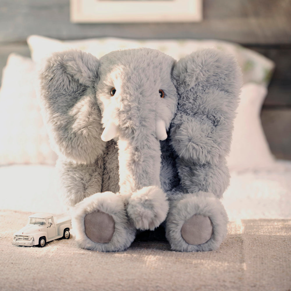 Gift-ready Vermont Teddy Bear Elephant in a warm setting.
