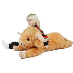 WDXDSOB Highland Cow plush on sofa adds cozy farmhouse charm