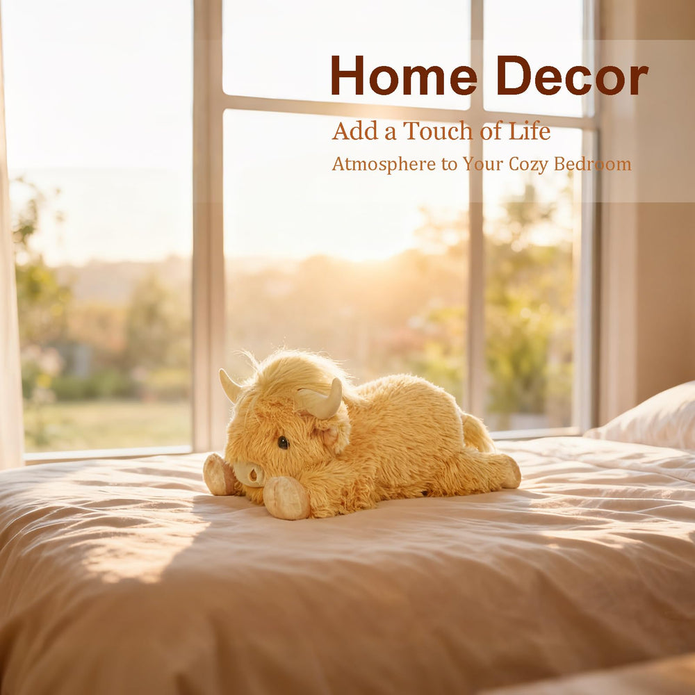 WDXDSOB weighted Highland Cow plush, full length on bed for decor.
