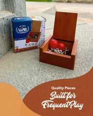WE Games gold jacks paired with red balls for family play.