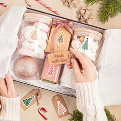 Whaline pine tree stickers decorate gift bags with holiday charm.