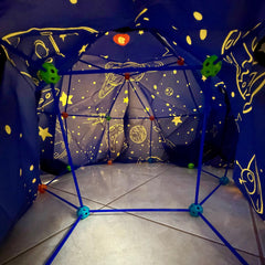 Backyard fort fun with Wizzly Space Blanket Fort Kit, indoor/outdoor versatility.