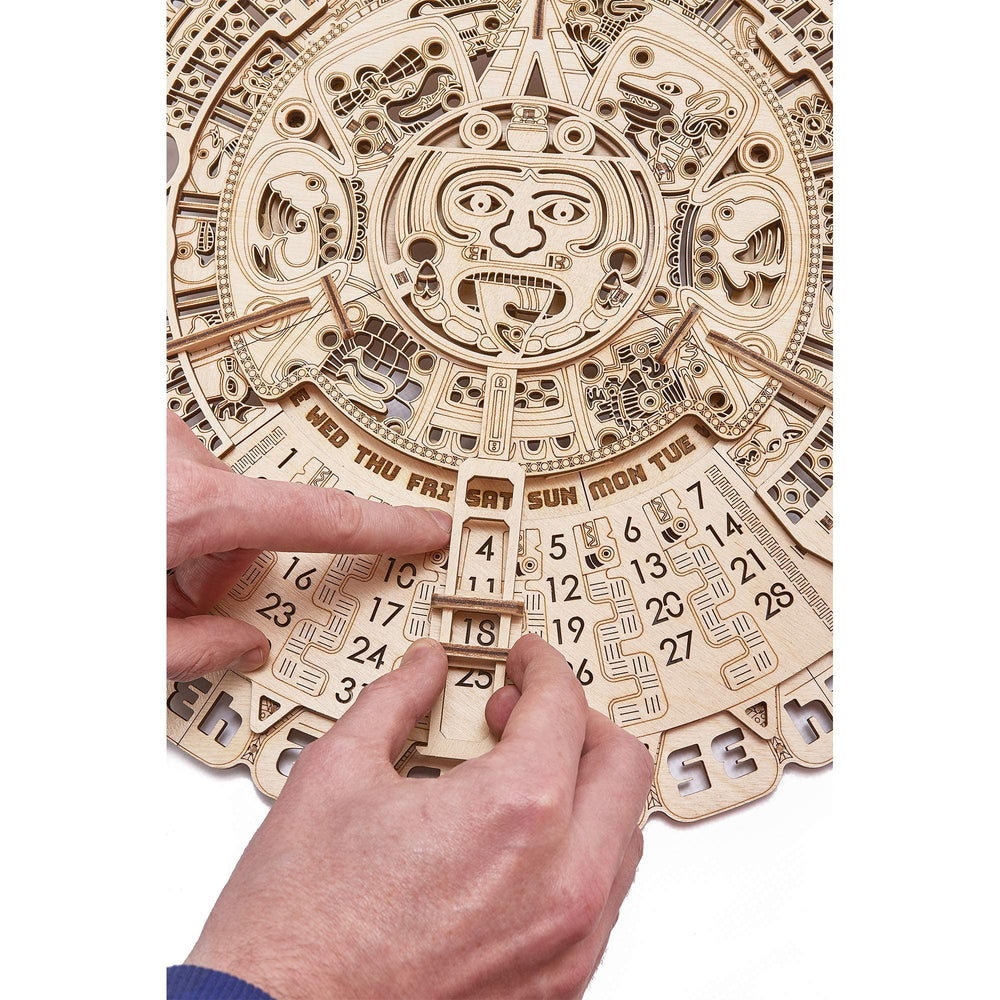 Wood Trick Mayan calendar movable-pattern panel demonstrates interactive mechanics for curiosity and learning.