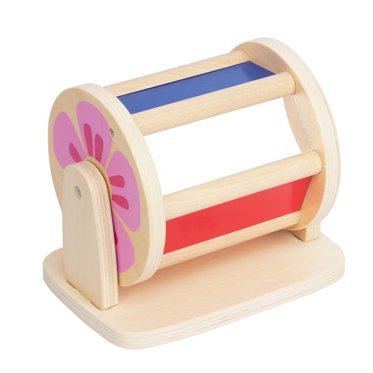 WOODENFUN Spinning Drum toy during tummy time to boost visual tracking.