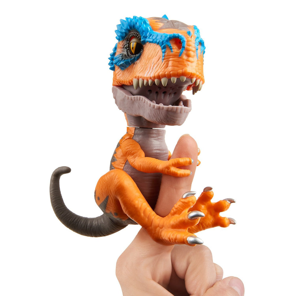 WowWee Untamed T-Rex Scratch orange closeup showing gripping jaws