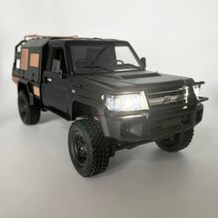 WPLDEWAN MN82S side view shows 4WD traction on terrain