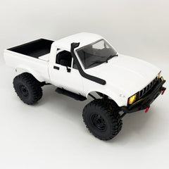 WPLDEWAN C24-1 with LED headlights for night-time off-road action.