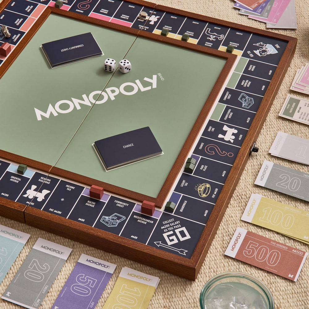 WS Game Company Monopoly Grand silver-tone die-cast tokens offer a tactile premium feel during play.