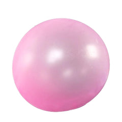 Wubble red bubble ball in action, ready for indoor and outdoor bounce sessions.