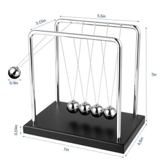 WXBRMCRY Newton's Cradle beads in motion illustrates physics principles in a calm desk setting.