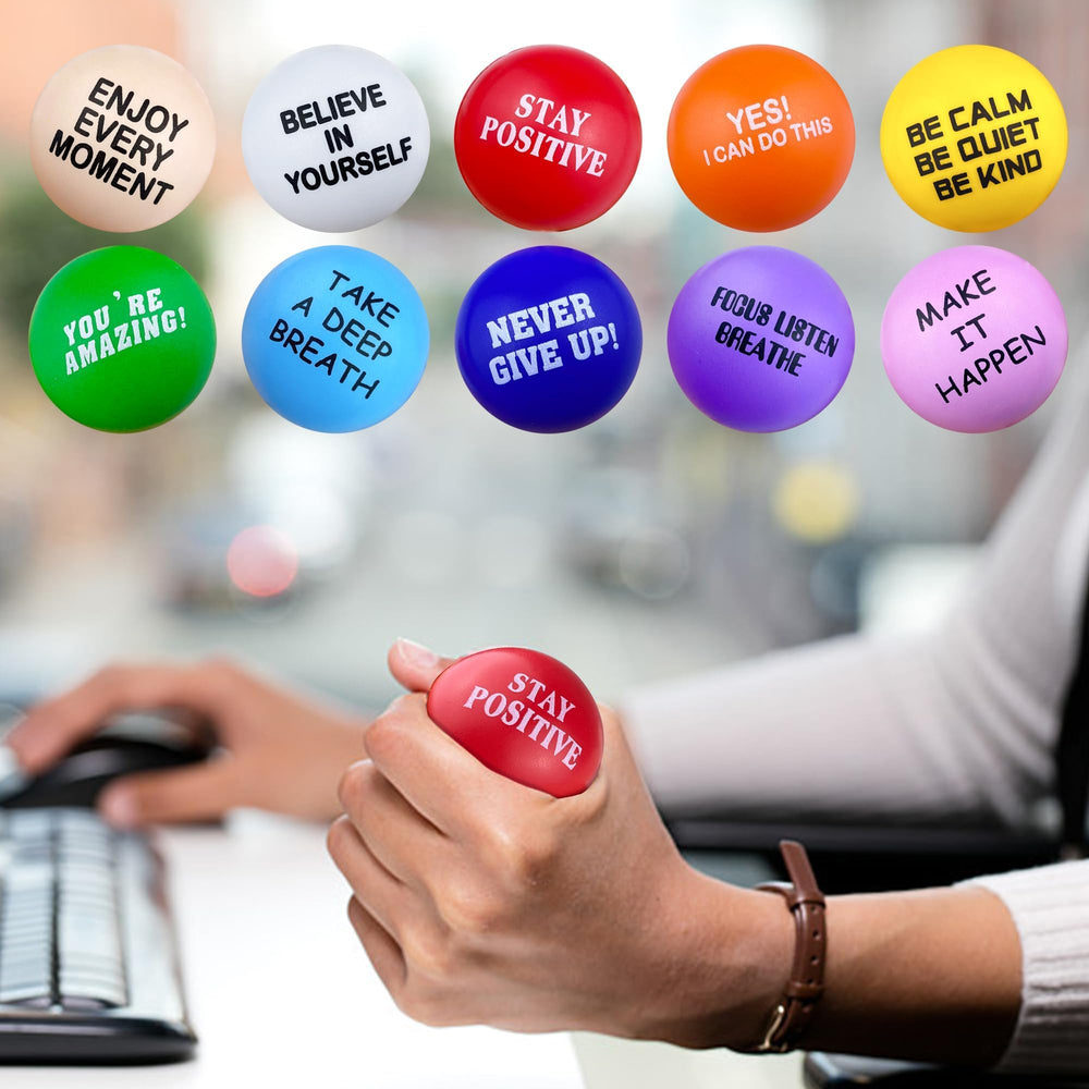 XIPEGPA motivational quote stress ball aiding focus during tasks at work.