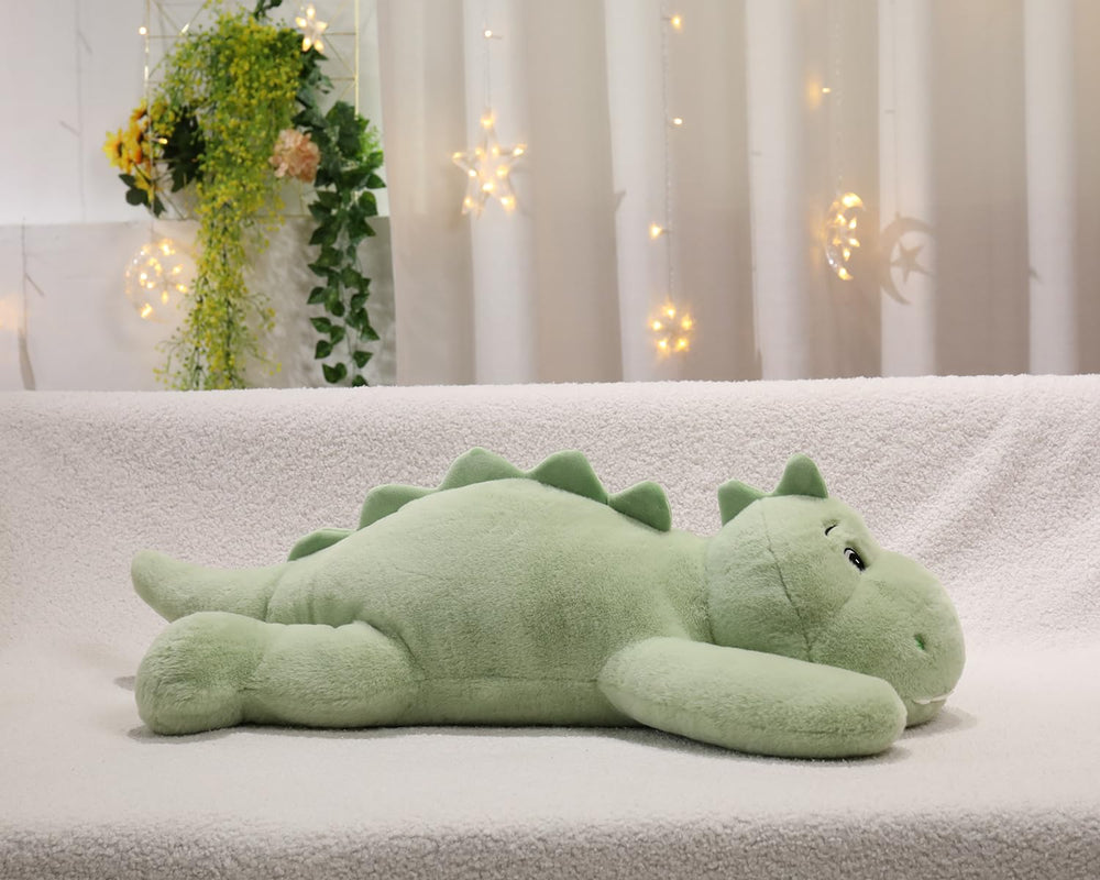 XMV dinosaur weighted plush face close-up, soft cuddleable texture.