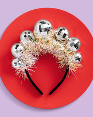 xo Fetti disco ball headband close-up of shiny balls and secure band.