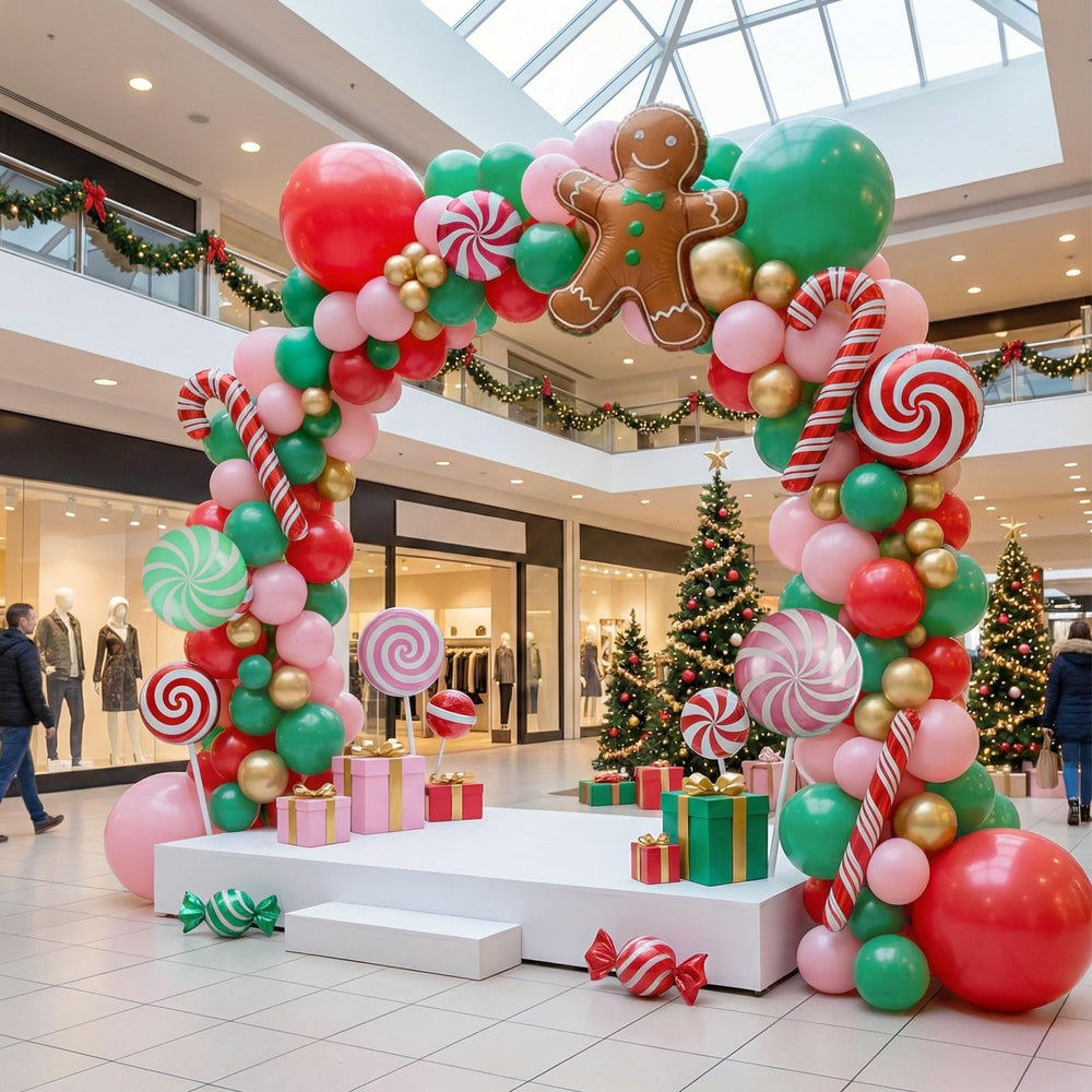 yeewaka Christmas balloon arch in green, pink, and red for a vibrant holiday backdrop.