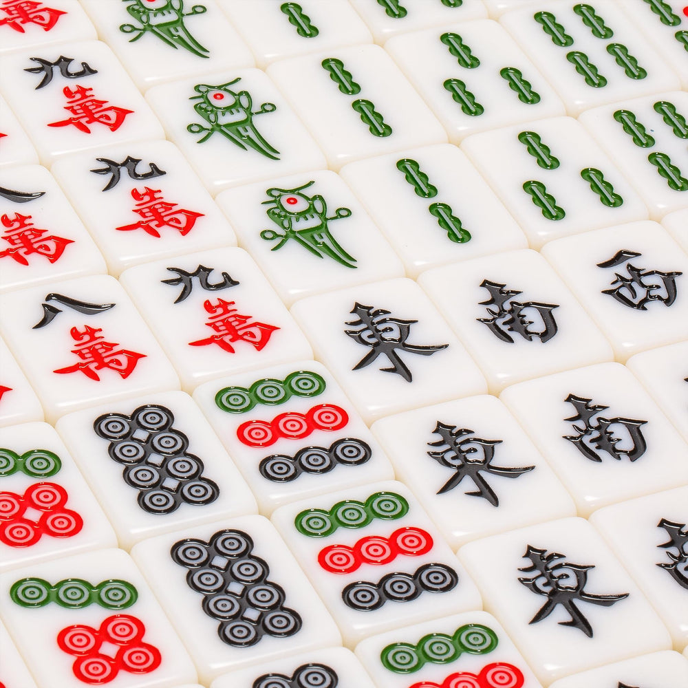 Green vinyl case with gold-plated handle housing Emerald Weave Mahjong set