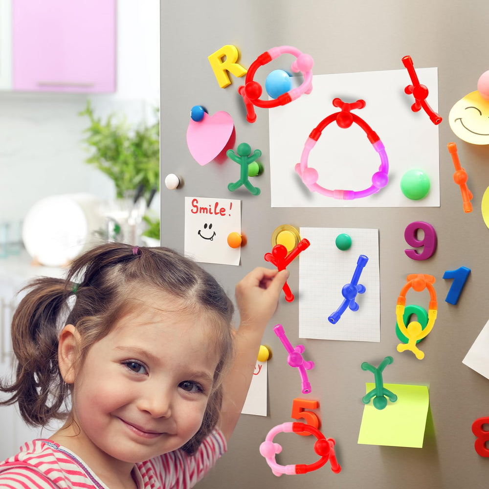 YOTNUS magnets display photos and artwork with colorful figures.