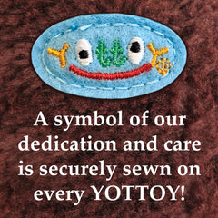 YOTTOY Grumpy Monkey plush with brown shaggy fur and embroidered features.