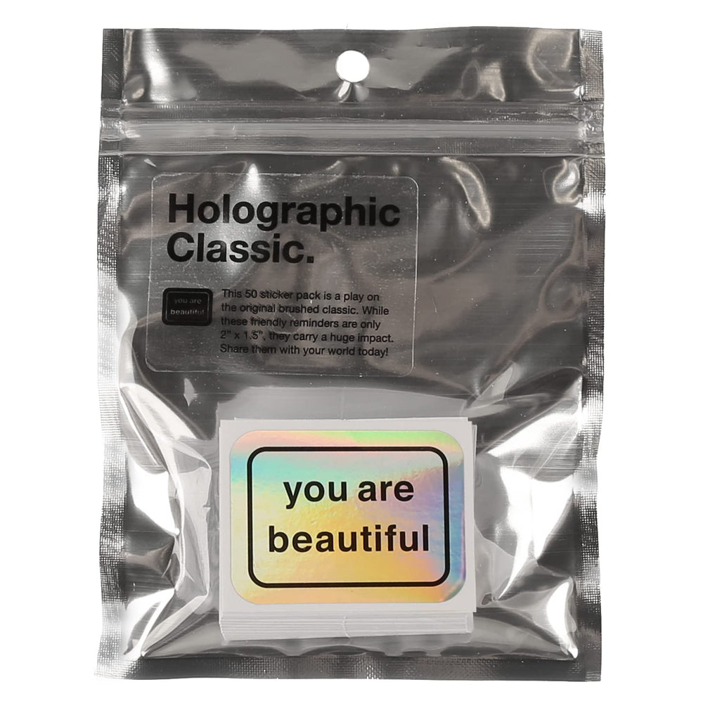 You Are Beautiful stickers on a laptop displaying hopeful messages
