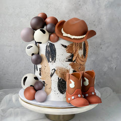 Zafena ball decorations bring colorful accents to the cake.