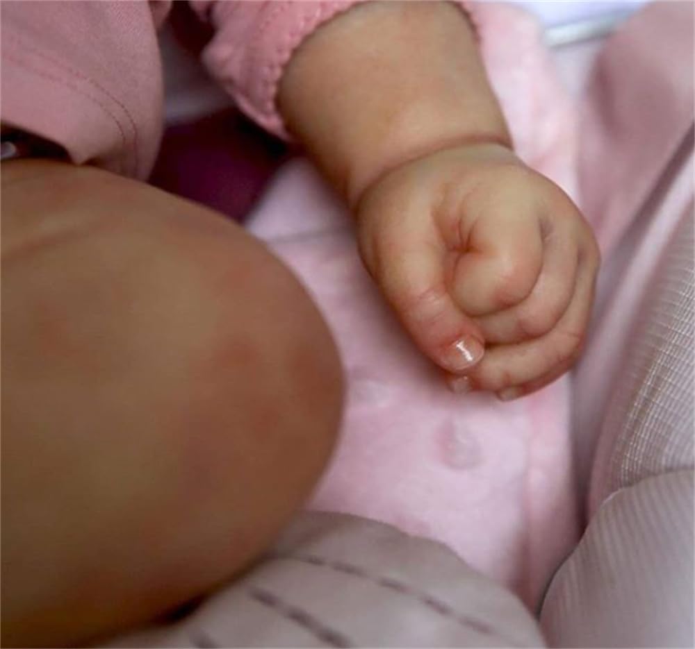 Zero Pam 20-inch reborn doll with hand-implanted blonde hair for natural styling.