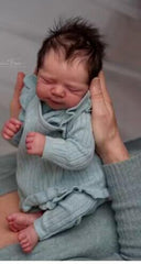 Zero Pam lifelike reborn baby doll with closed eyes and soft vinyl skin for cuddling