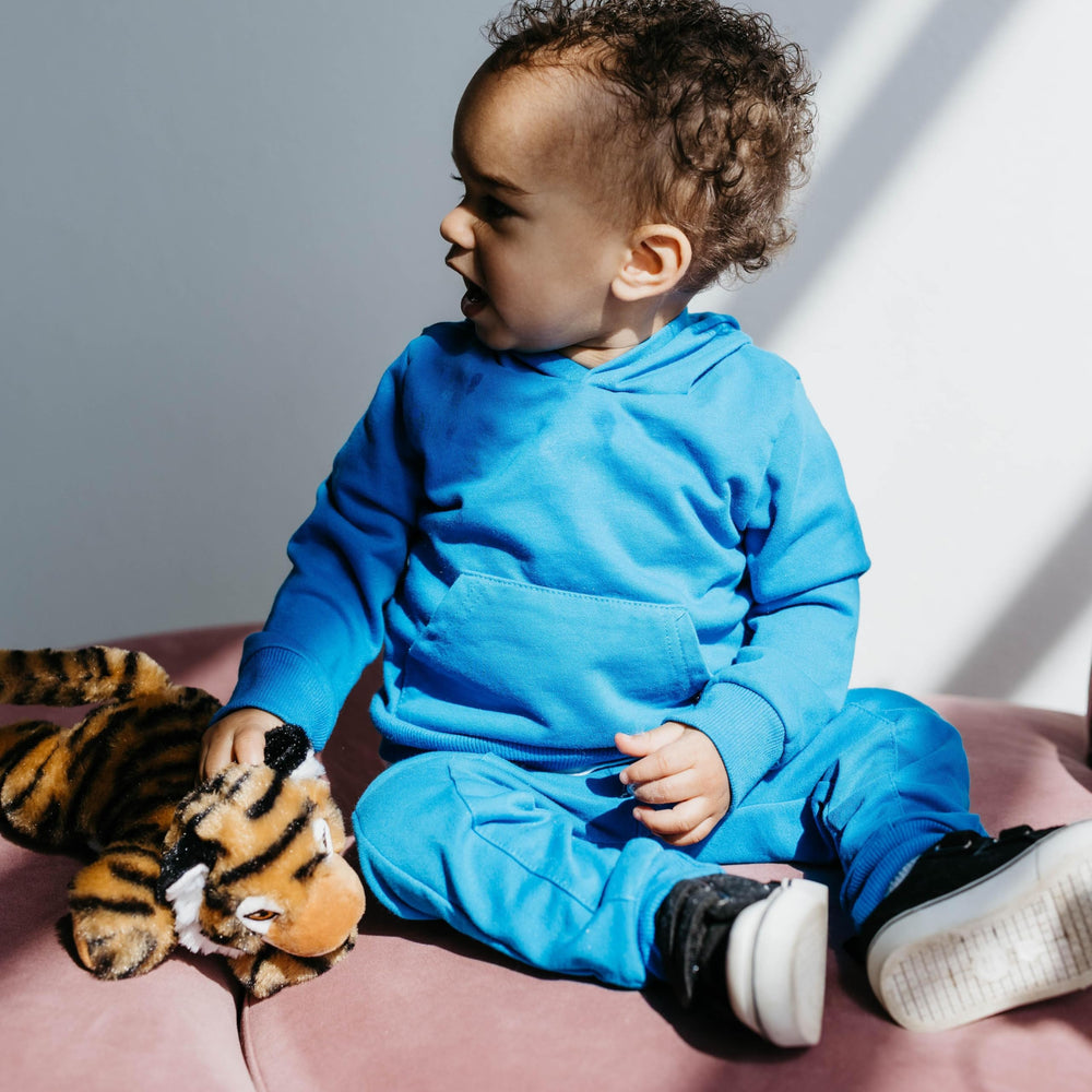 Zoologee tiger prowling presence invites curious discovery of predators in screen-free play.