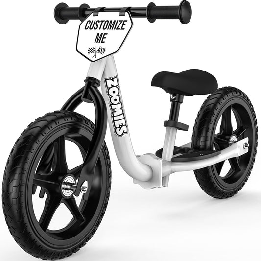 Zoomies folding balance bike folded compact for storage and travel.
