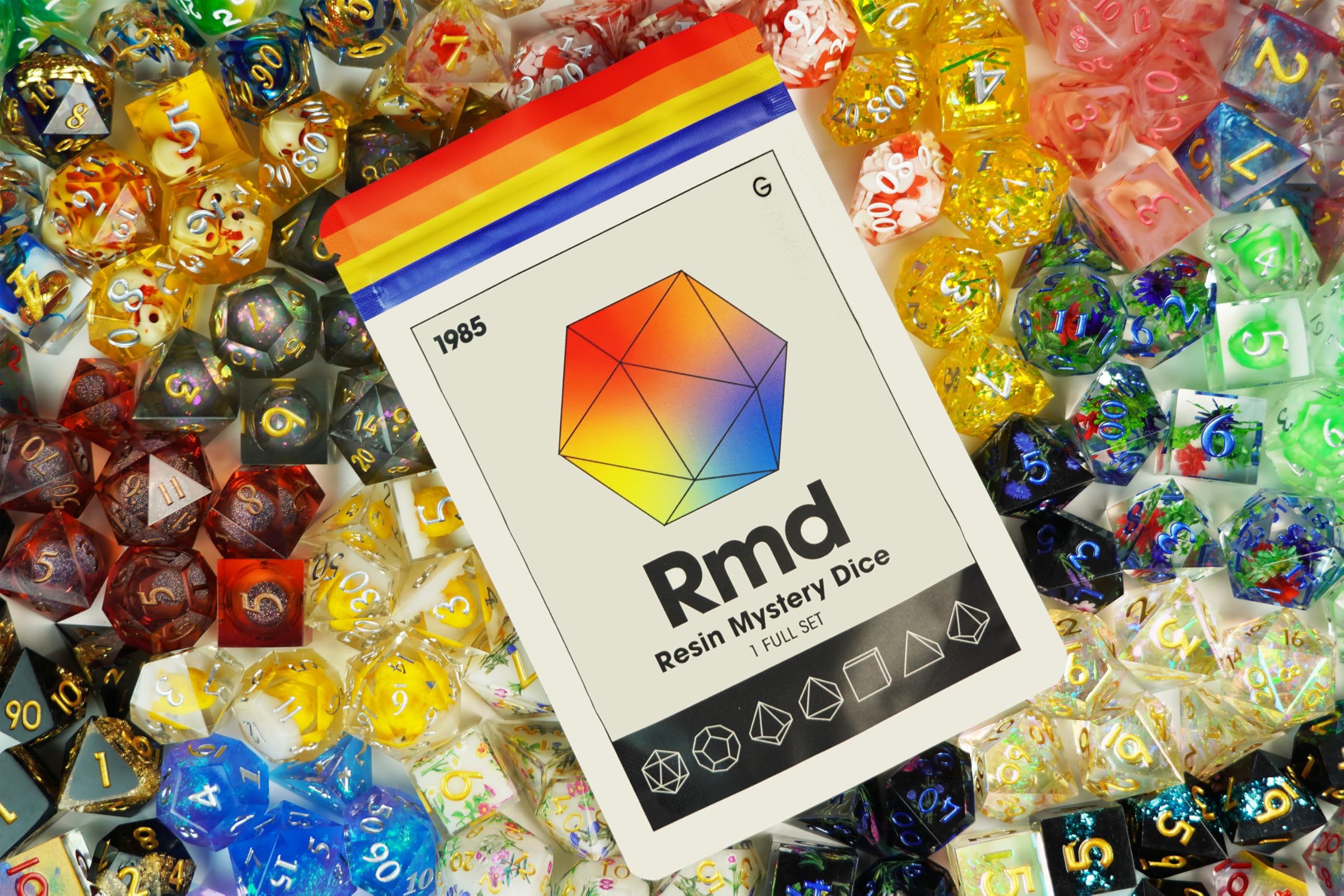 1985 Games Sharp Edge Dice Set resin with vibrant color on tabletop for dramatic effect.