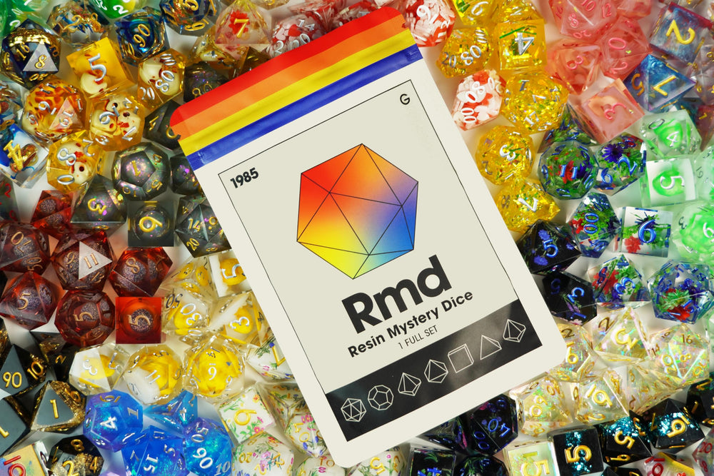1985 Games Sharp Edge Dice Set resin with vibrant color on tabletop for dramatic effect.