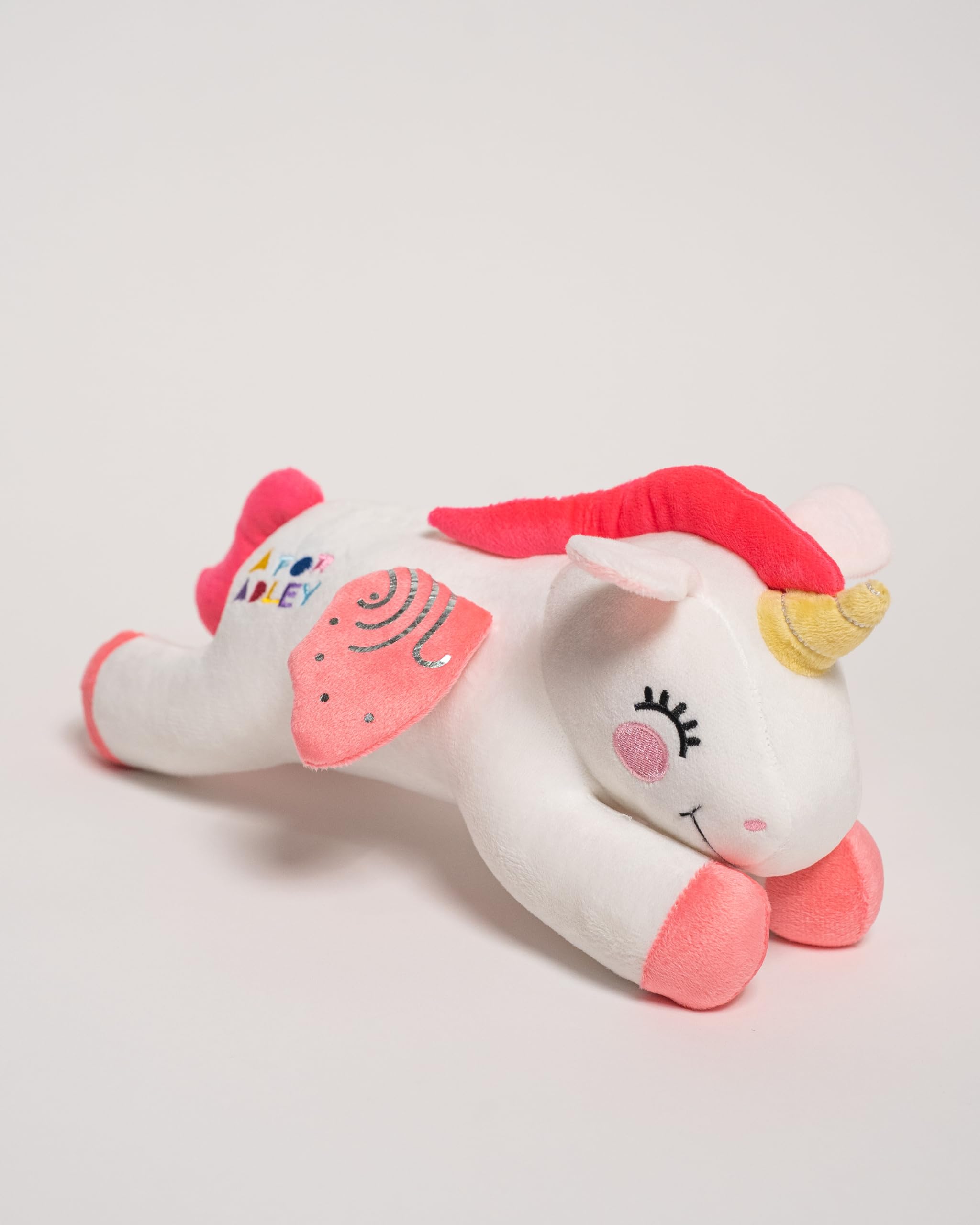 A FOR ADLEY plush with pink hooves and wings, great for roleplay adventures.