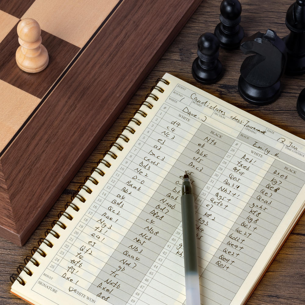 A&A chess scorebook interior with clear grids for easy move logging