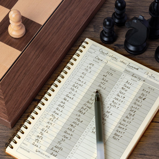 A&A chess scorebook interior with clear grids for easy move logging