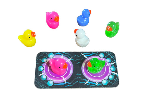 Abducktion IntergalacDuck boards and glitter ducks ready for up to six players.