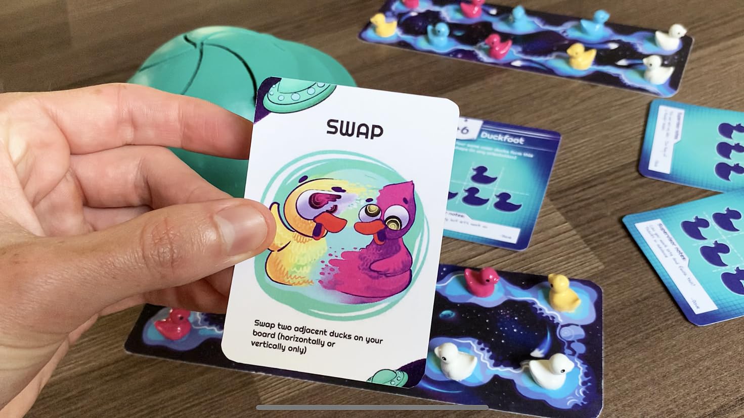 Abducktion IntergalacDuck challenging formation cards in action during play.