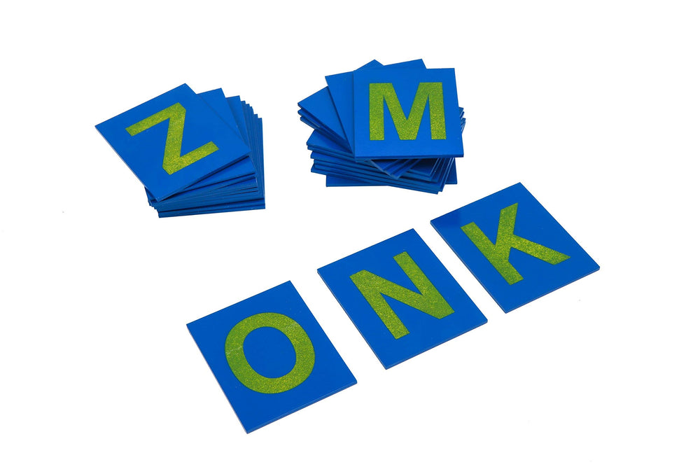 Adena Montessori word-building activity using traced letters to form words