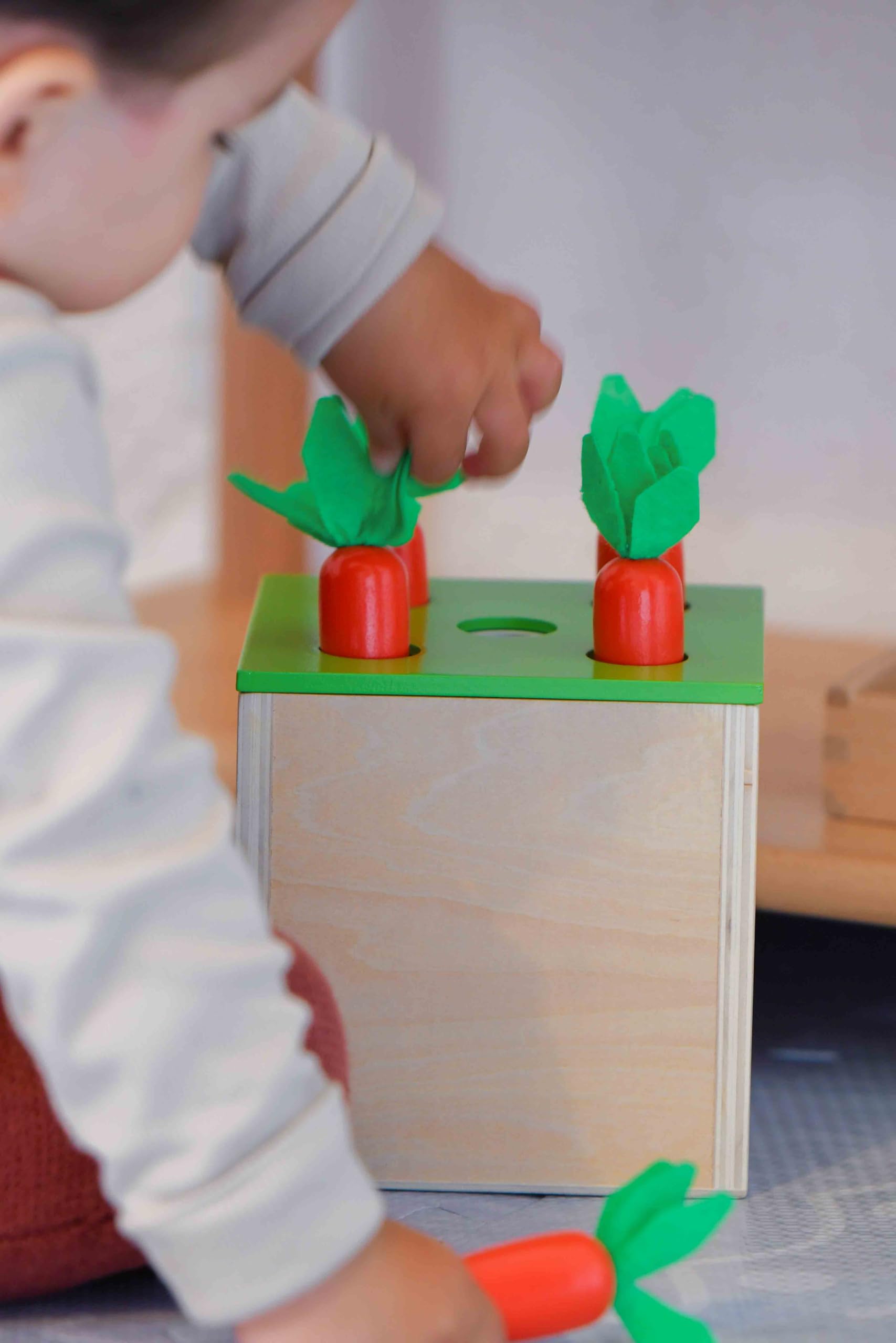 Adena Montessori matchstick color drop game close-up, improving hand-eye coordination.