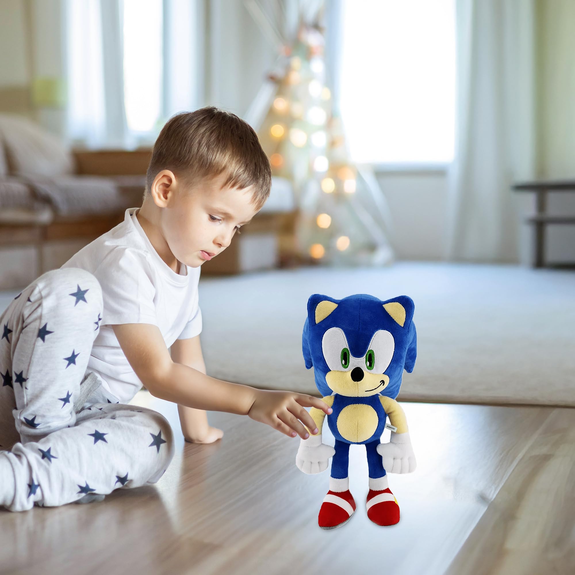 Adenzai blue plush toy being hugged by a child