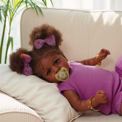 ADFO Reborn Black Baby Doll nursing bottle included for feeding play.