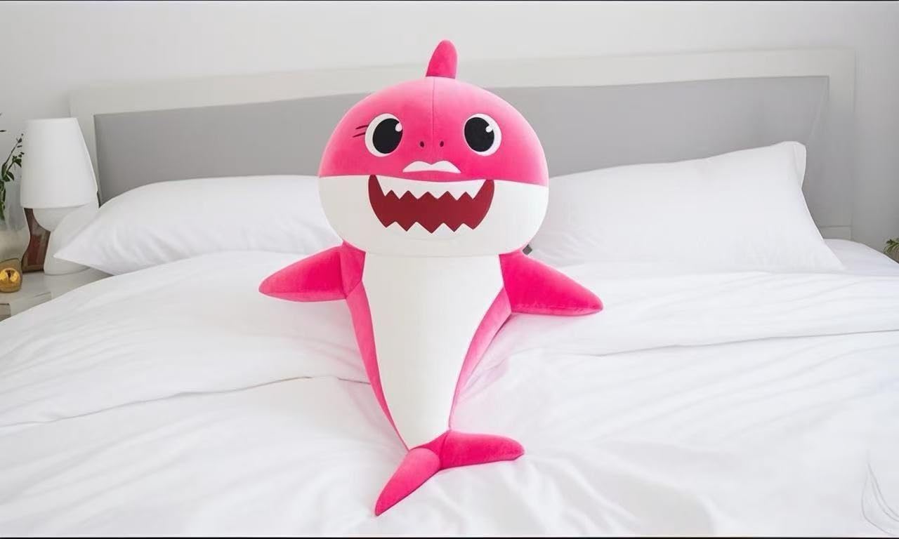 Adorable Shark Plush Toy pink body side view, ideal for imaginative play and room decor.