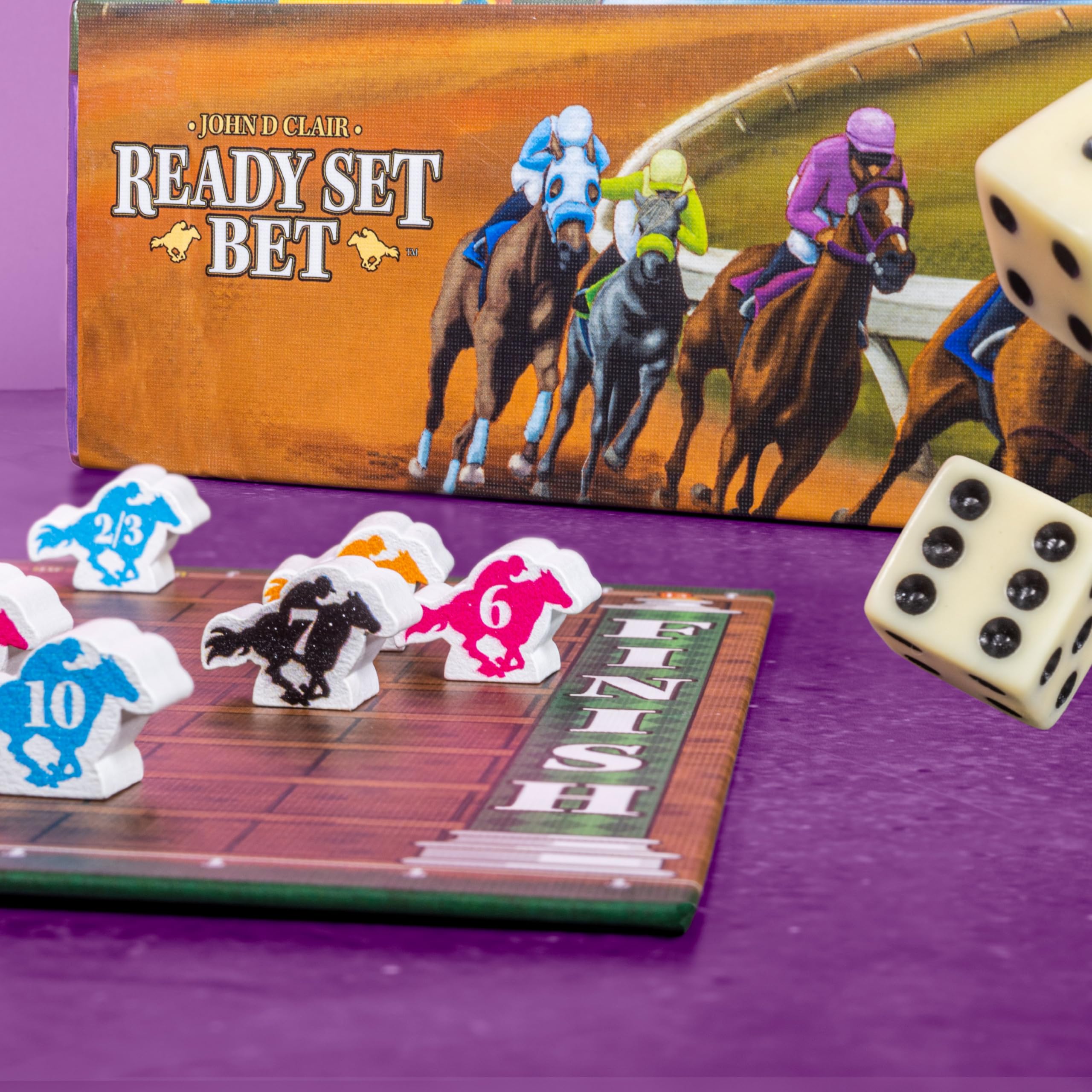 AEG Ready Set Bet race-style table layout with dice and chips in action.