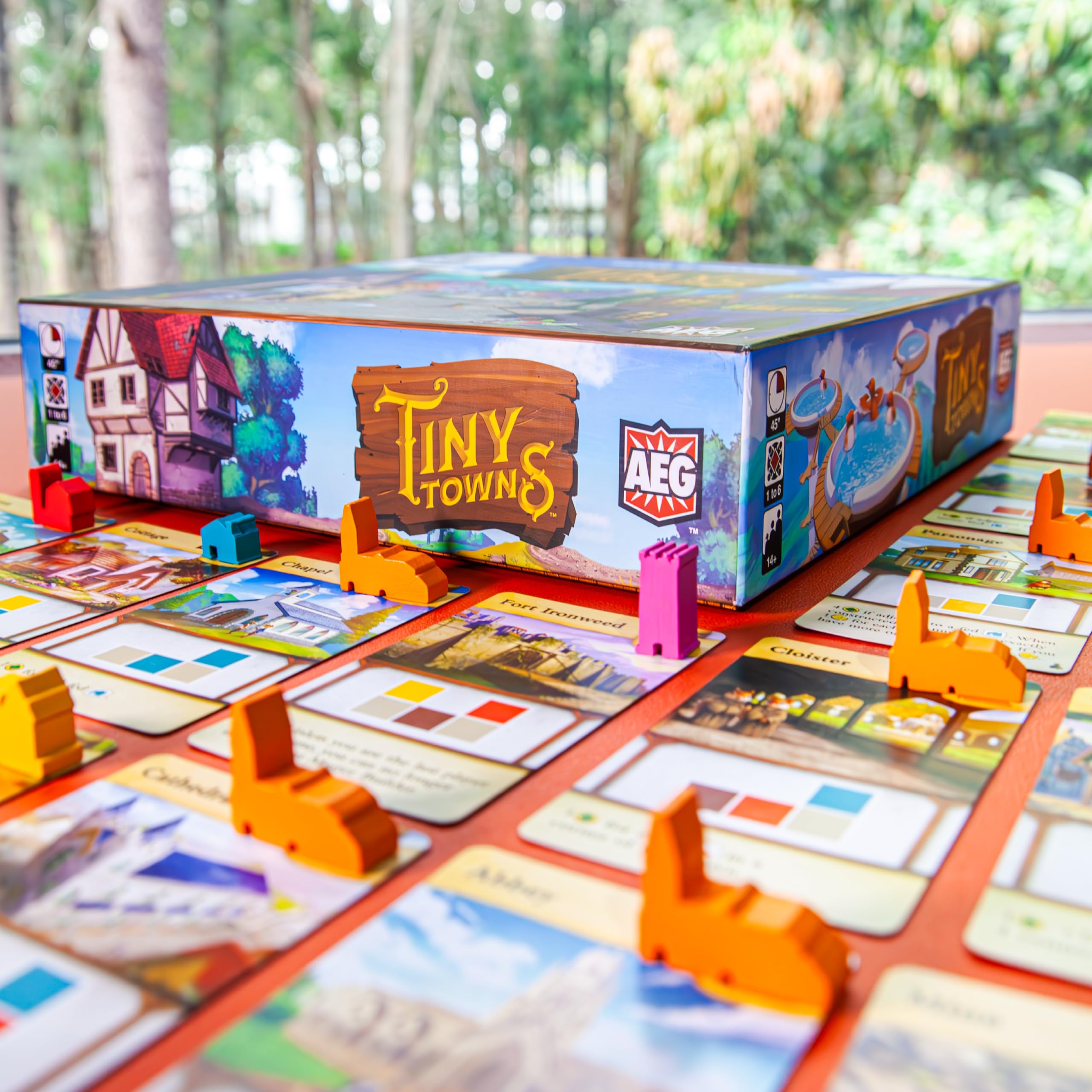 AEG Tiny Towns four-by-four grid creates varied layouts for replayability.